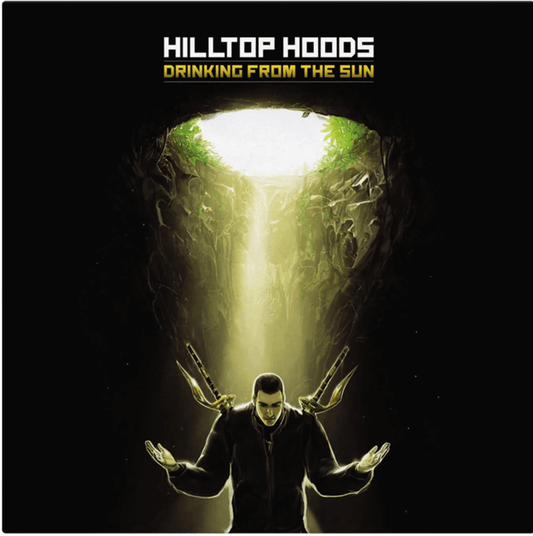 Album cover for 'Drinking From The Sun' by Hilltop Hoods with a person in a dark outfit and antlers standing in front of a glowing cave entrance.