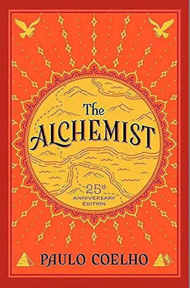 The Alchemist 25th Anniversary Edition by Paulo Coelho, paperback modern classic.