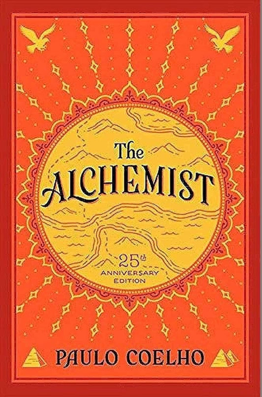 The Alchemist 25th Anniversary Edition by Paulo Coelho, paperback modern classic.