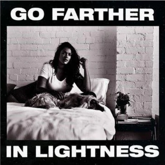 Gang of Youths – Go Farther in Lightness album cover: black-and-white photo of a woman sitting on a bed with a dog; bold title text top and bottom.