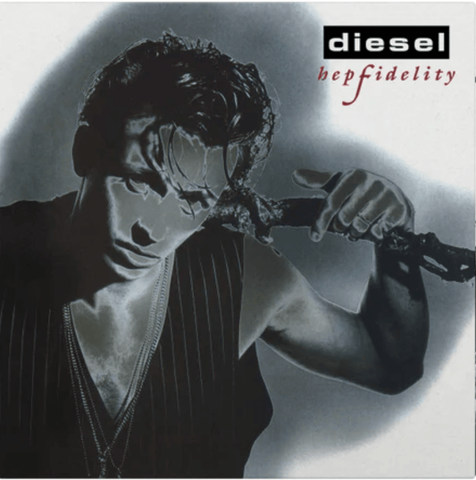 Album cover of Hepfidelity by Diesel, showing a black-and-white portrait of the artist with wet hair and layered necklaces, holding a tree branch across his shoulders, with the band name in a black box and album title in red script.