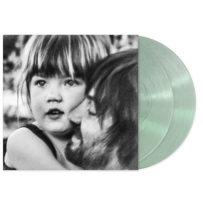 Tame Impala latest album.. Vinyl record with a black and white photo of a child on the cover and two coke bottle green vinyl lp