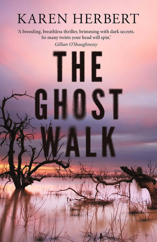 Book cover of 'The Ghost Walk' by Karen Herbert with a silhouette of trees and a sunset.